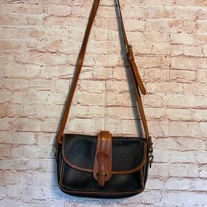 Vintage dooney & bourke all weather leather equestrian purse in black & brown.